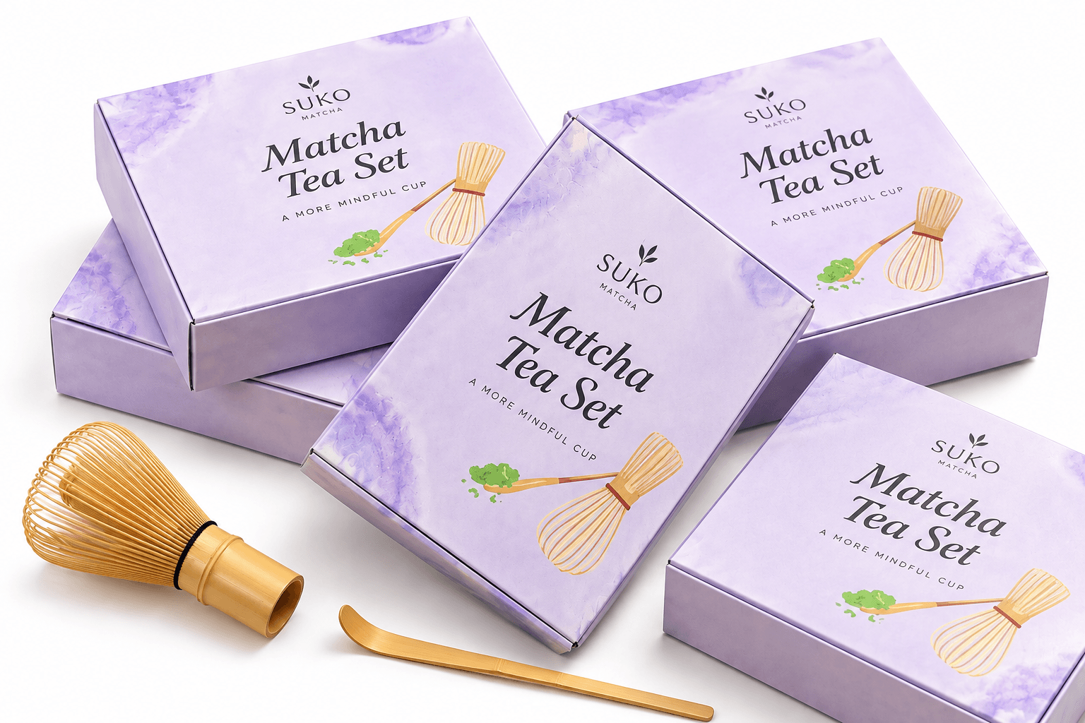 Five Suko Matcha Tea Set gift boxes with a bamboo whisk and chashaku spoon